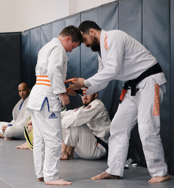 Why Train with AJJ? Kids below logo